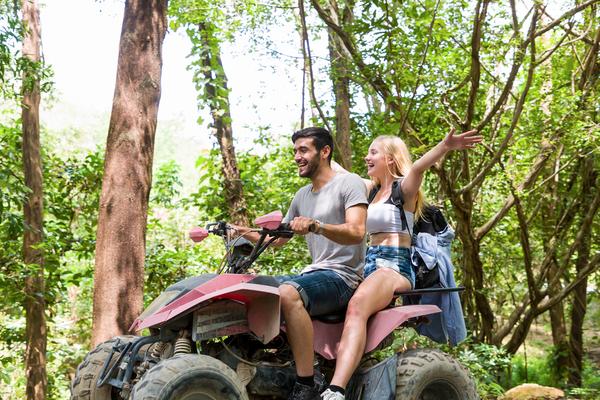 Couple Riding On Atv Bike