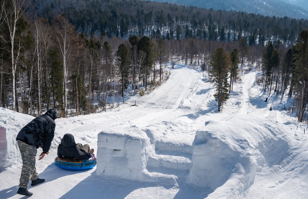 Tourist Playing Snow Tubing